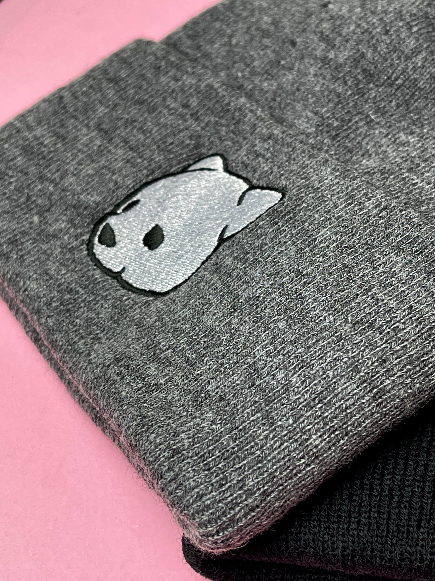 Gray beanie featuring Luke Chueh's bear head. Published by Plush Art Club.