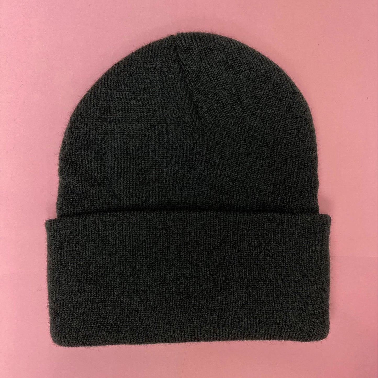 Black beanie featuring Luke Chueh's bear head. Published by Plush Art Club. Back-side view.