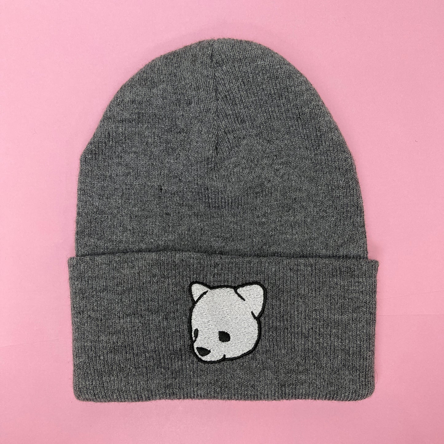 Gray beanie featuring Luke Chueh's bear head. Published by Plush Art Club.