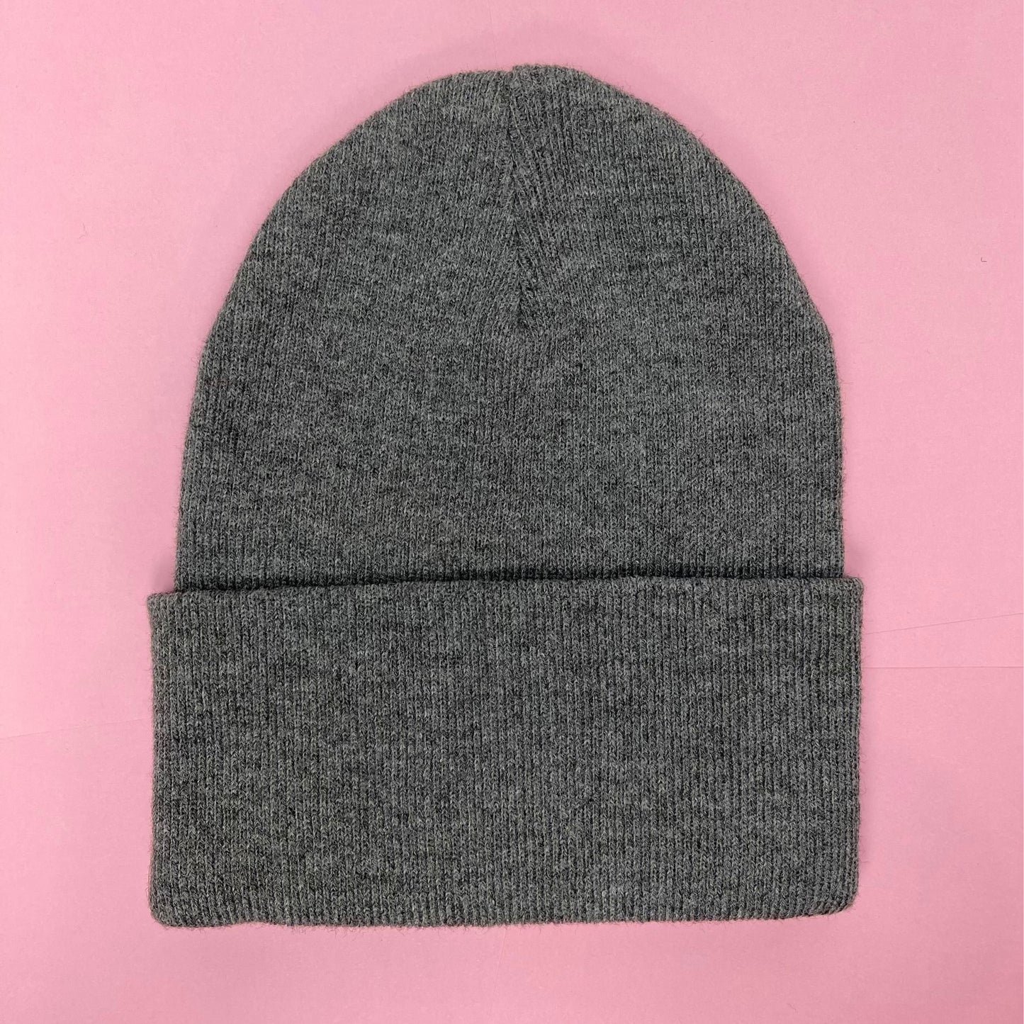 Gray beanie featuring Luke Chueh's bear head. Published by Plush Art Club. Back-side view.