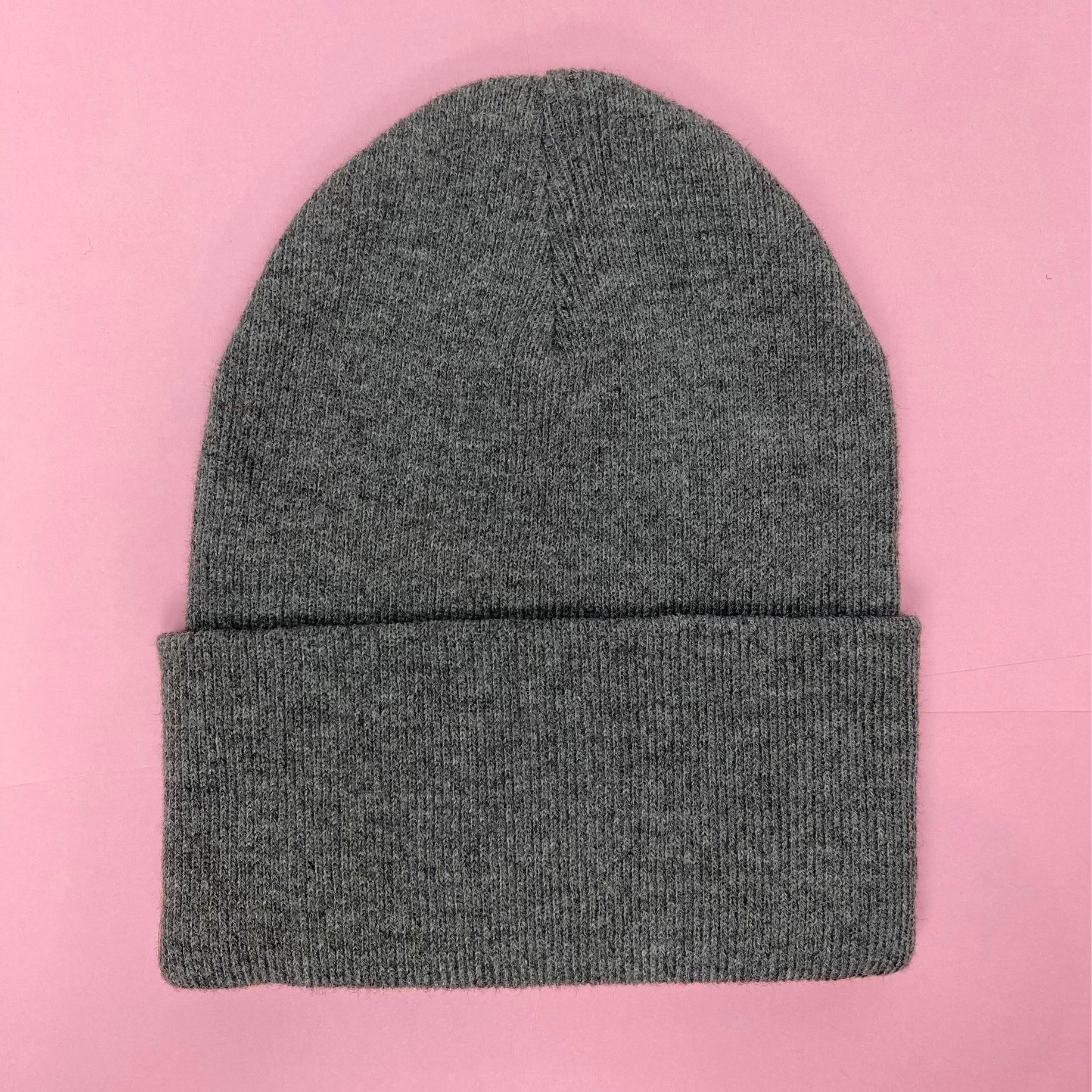 Gray beanie featuring Luke Chueh's bear head. Published by Plush Art Club. Back-side view.