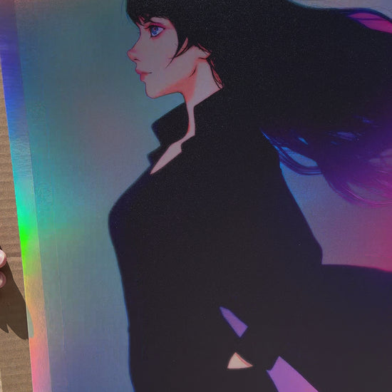 Actual video of Ilya Kuvshinov's Kaze no Iro artprint on holofoil. It depicts a girl wearing black with her coat flapping in the winds. The background features many colors and is on a holofoil stock.