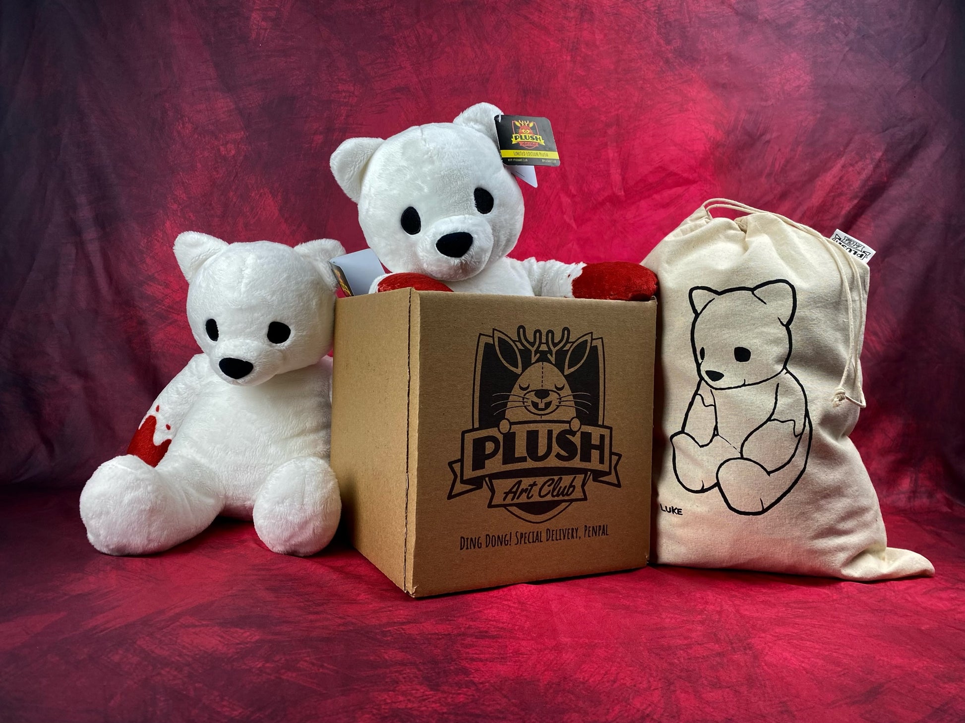 Luke Cheuh's bear as a limited-edition plush, published by Plush Art Club with design by Luke Chueh. The packaging for the bear is a dust bag with an image of Luke Chueh's bear as a plush.